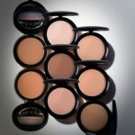 A selection of compact powders in various shades, suitable for diverse skin tones.